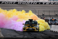 Car with colored smoke during burnout