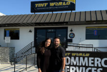 Armin and Michelle Barandeh standing in front of their new Tint World franchise in Torrance, California