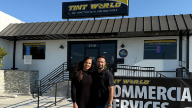 Armin and Michelle Barandeh standing in front of their new Tint World franchise in Torrance, California