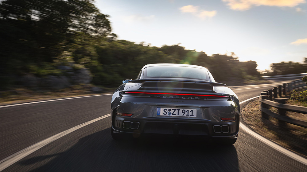 2026 911 Turbo S driving on road from rear
