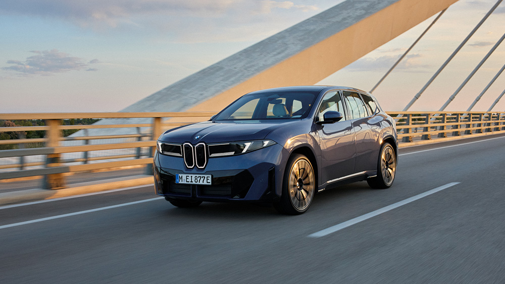 BMW iX3 driving on bridge