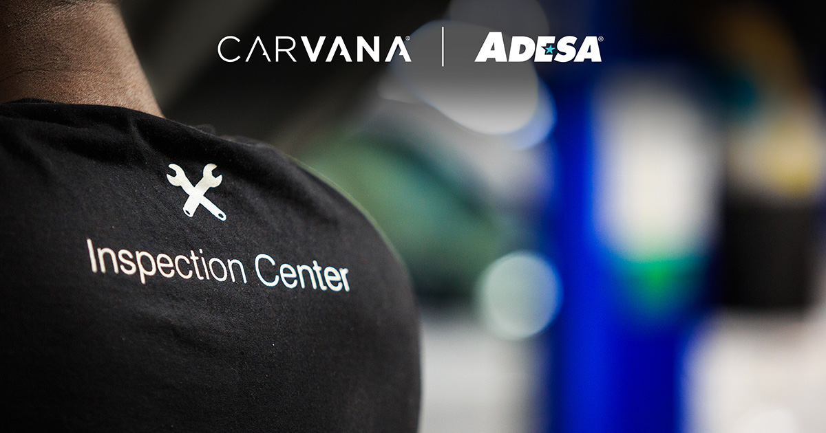 Back of persons T-shirt with Carvana ADESA Inspection Center logo