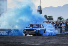 Car doing burnout with blue smoke