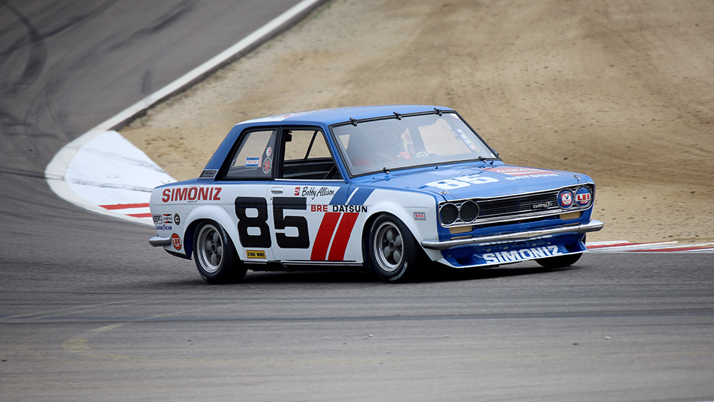 Classic race car on track at Rolex Monterey Motorsports Reunion