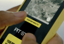 Person using Pennzoil Drives app on smartphone