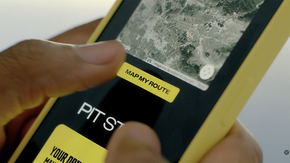 Person using Pennzoil Drives app on smartphone
