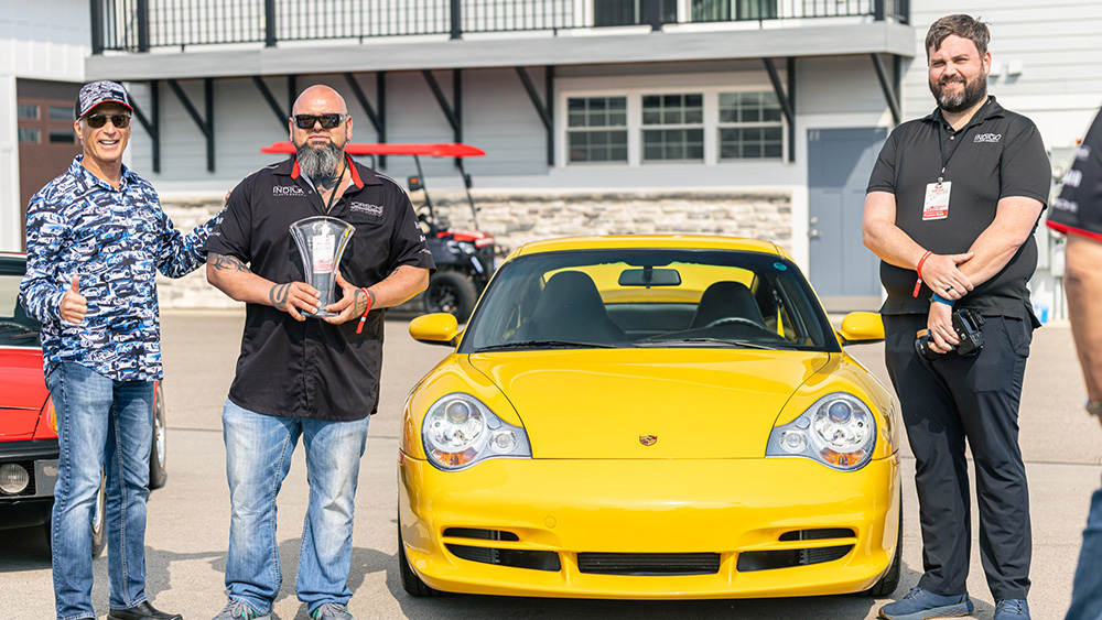 Speed Yellow 2004 911 GT3 and the Porsche North Houston group with trophy
