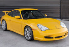 Speed Yellow 2004 911 GT3 parked in front of garage