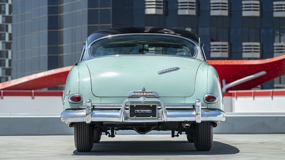 Steve McQueen’s Hudson Wasp from rear parked on rooftop in city