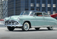 Steve McQueen’s Hudson Wasp from side parked on rooftop in city