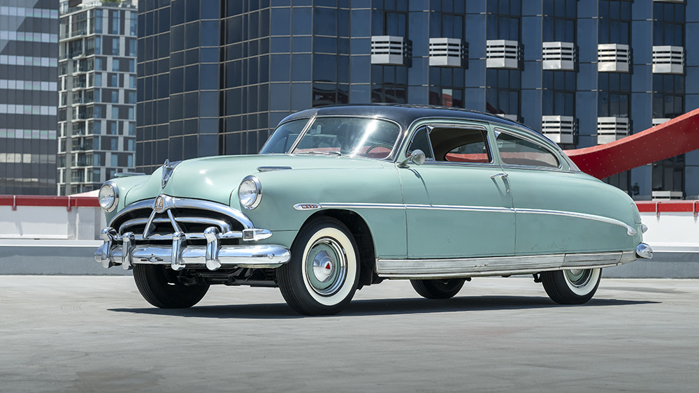 Steve McQueen’s Hudson Wasp from side parked on rooftop in city