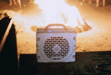Turtlebox speaker in truck bed with beach campfire