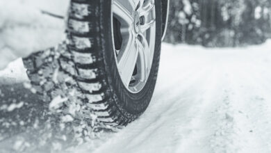 Closeup of tire driving through snow