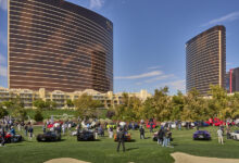 Concours at Wynn Las Vegas with cars and crowd on golf course and the Wynn Casino in the background