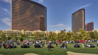 Concours at Wynn Las Vegas with cars and crowd on golf course and the Wynn Casino in the background