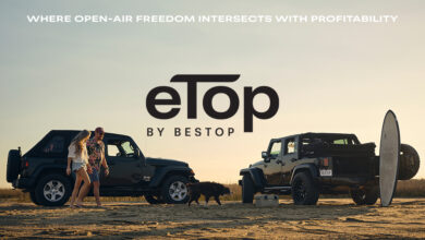 Two Jeeps parked at beach with eTop logo