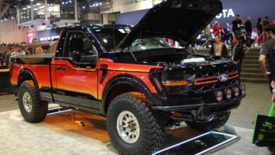 sema show 2025 lifted black, orange and red Ford lifted pickup in central hall