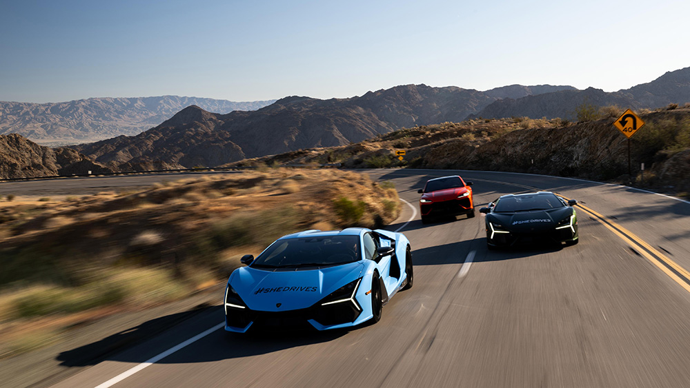Three Lamborghinis driving on road