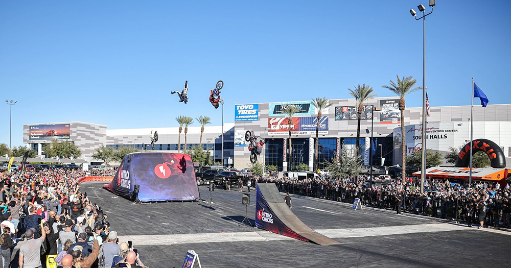 Three bikes jumping ramps at Nitro Circus SEMA Show