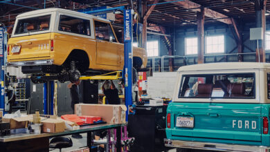 Two Ford Broncos in shop being conerted to EVs