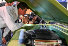 Young mechanics working on Battle of the Builders projecct car