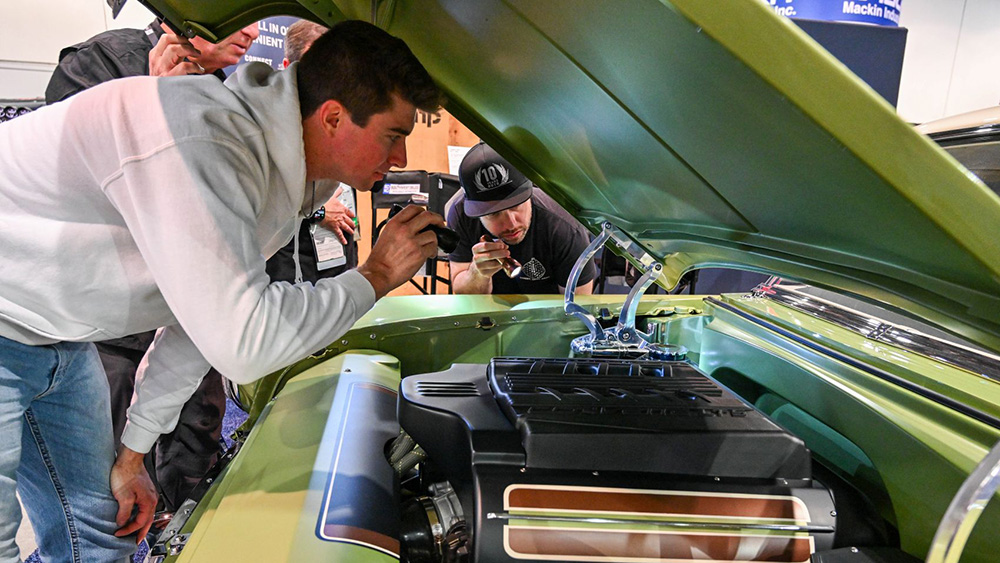 Young mechanics working on Battle of the Builders projecct car
