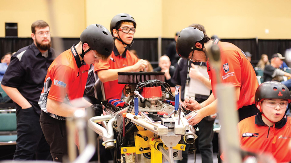 Students building engine at PRI Show