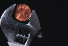 Wrench holding a penny