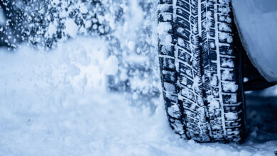 Winter tire. Detail of car tires in winter on the road
