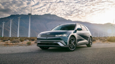 MY25 Hyundai IONIQ 5 parked in front of wind farm