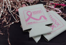 RNR Breast Cancer Awareness Koozies on table with streamers