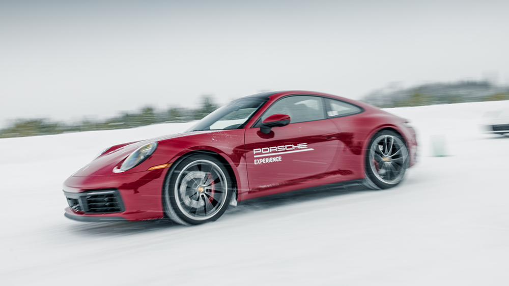 Red Porsche driving in Porsche Ice Experience