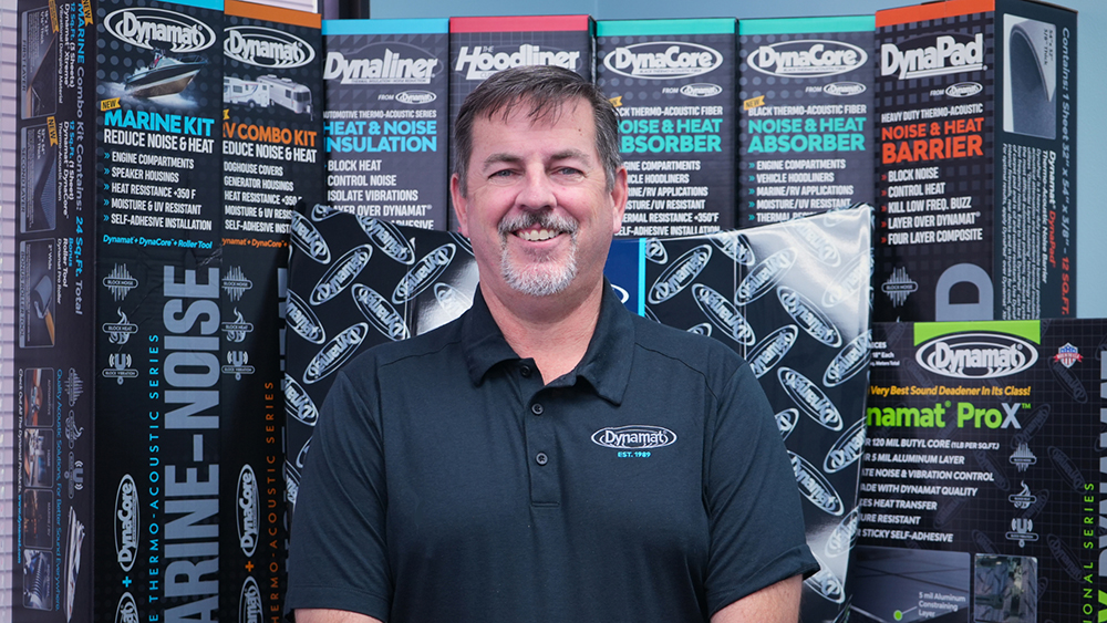 Thad Smith in front of Dynamat promotional signage
