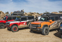 Broncos parked in a line at King of the Hammers
