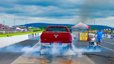 Diesel pickup truck smoking tires on drag strip