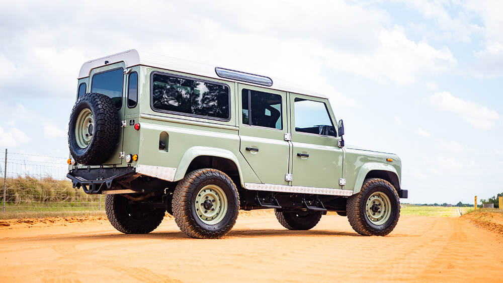 ECD Heritage Line Defender from rear parked on clay road