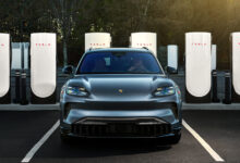 Porsche 2026 Taycan parked in front of Tesla Superchargers