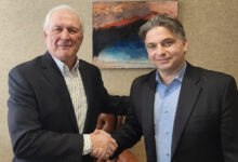 Ray Proulx and Shaun Kelso shake hands at KYB