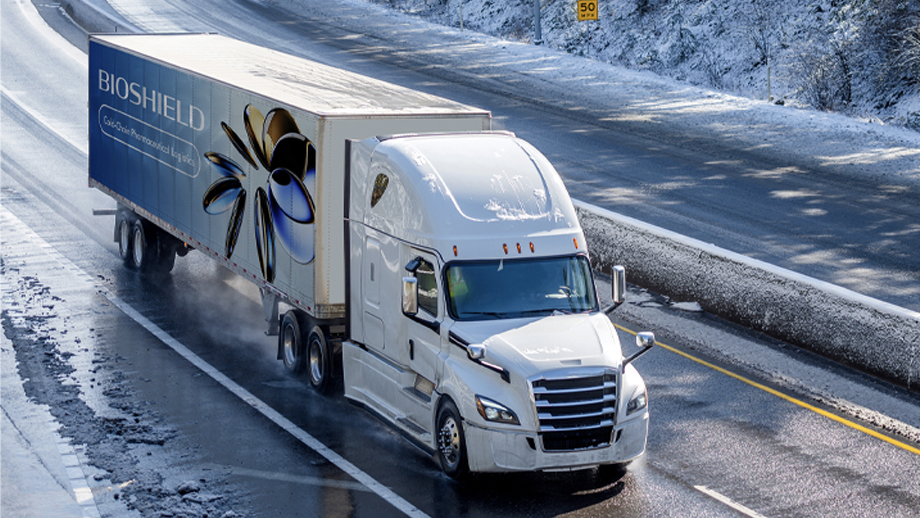 Semi truck with graphic wrap on icy road