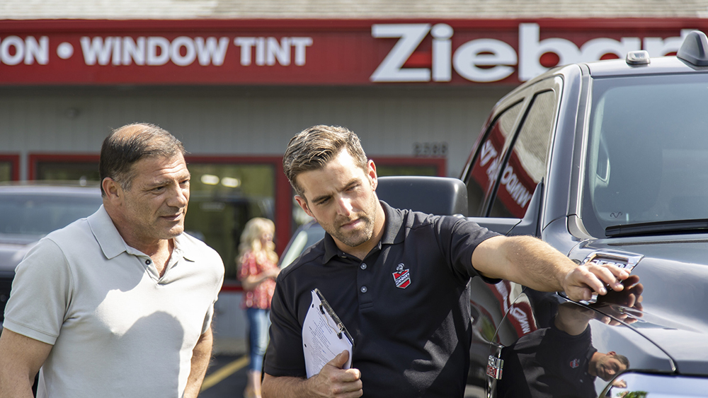 Ziebart rep talking to customer