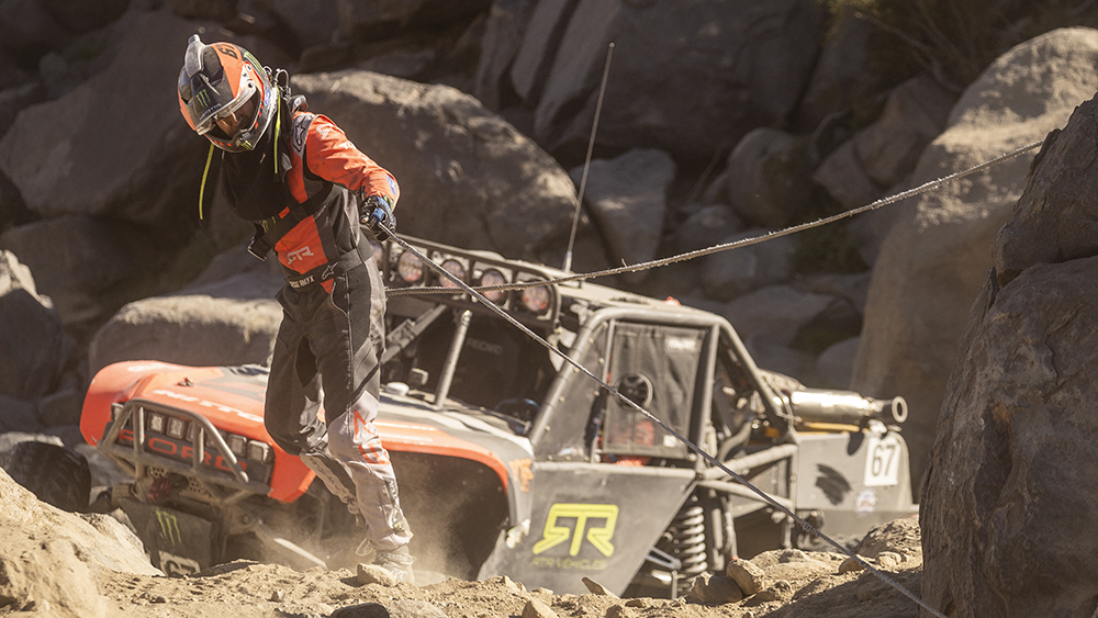 Racer trying free stuck vehicle in the Race of Kings at King of the Hammers