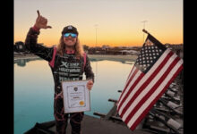 Blake Wilkey holding Word Record certificate