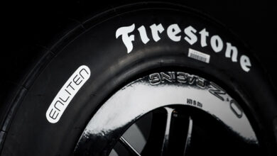 Closeup of Firestone Racing Firehawk race tires with ENLITEN technology.