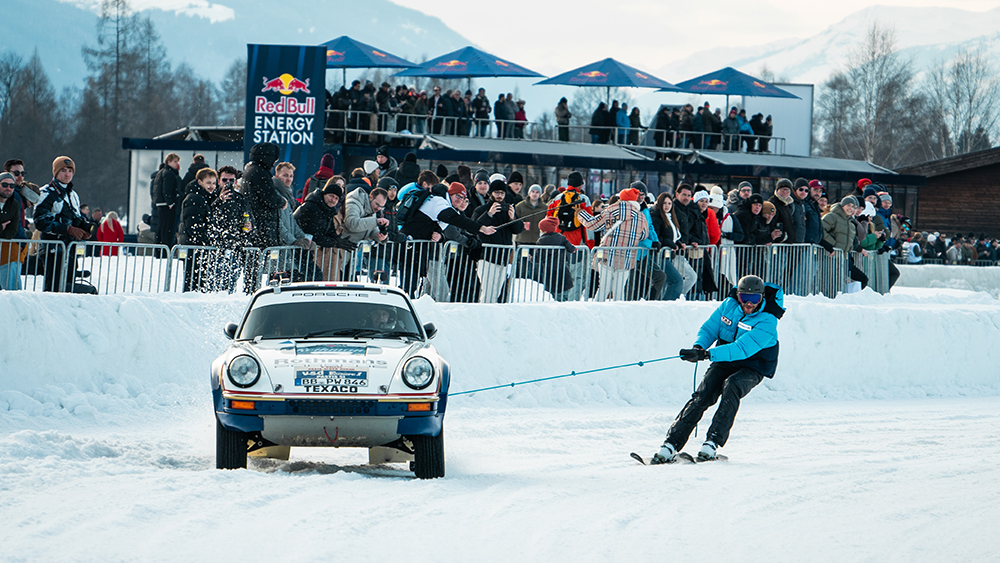 Man sking behind Porsche at FAT Ice Race