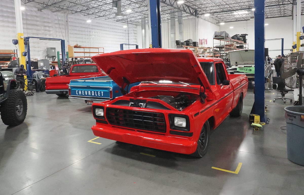 fat fender garage red truck in work bay