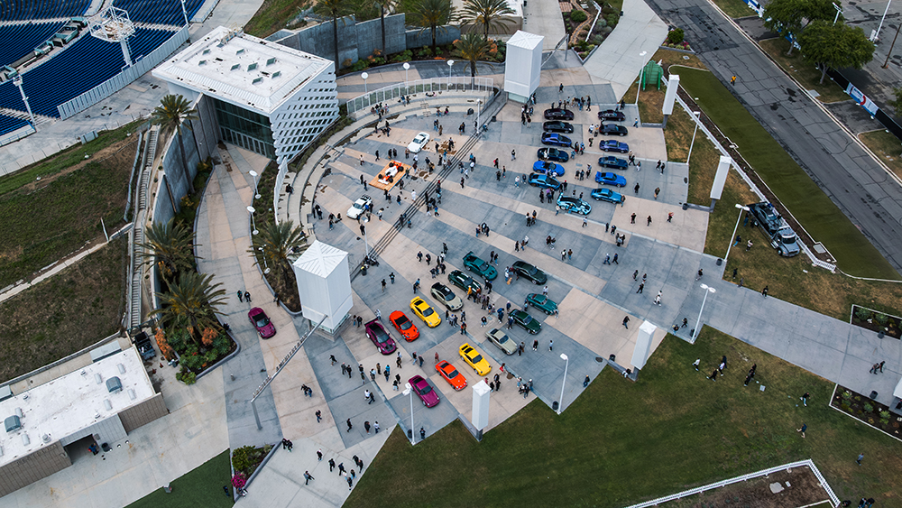 Overhead view of Porsches and event venue at AirWater by Shafik