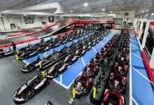 The pit lane at K1 Speed Totowa features four rows of adult go-karts and two rows of junior go-karts.