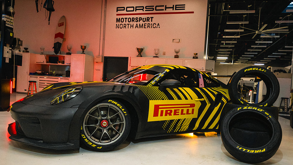 Porsche Cup car in garage with Pirelli tires