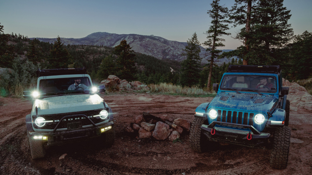A Bronco and a Jeep featuring the Bestop Sunrider for Hardtop
