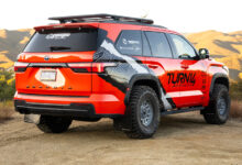 Red T14 x SuperPro Toyota Sequoia TRD parked in the hills